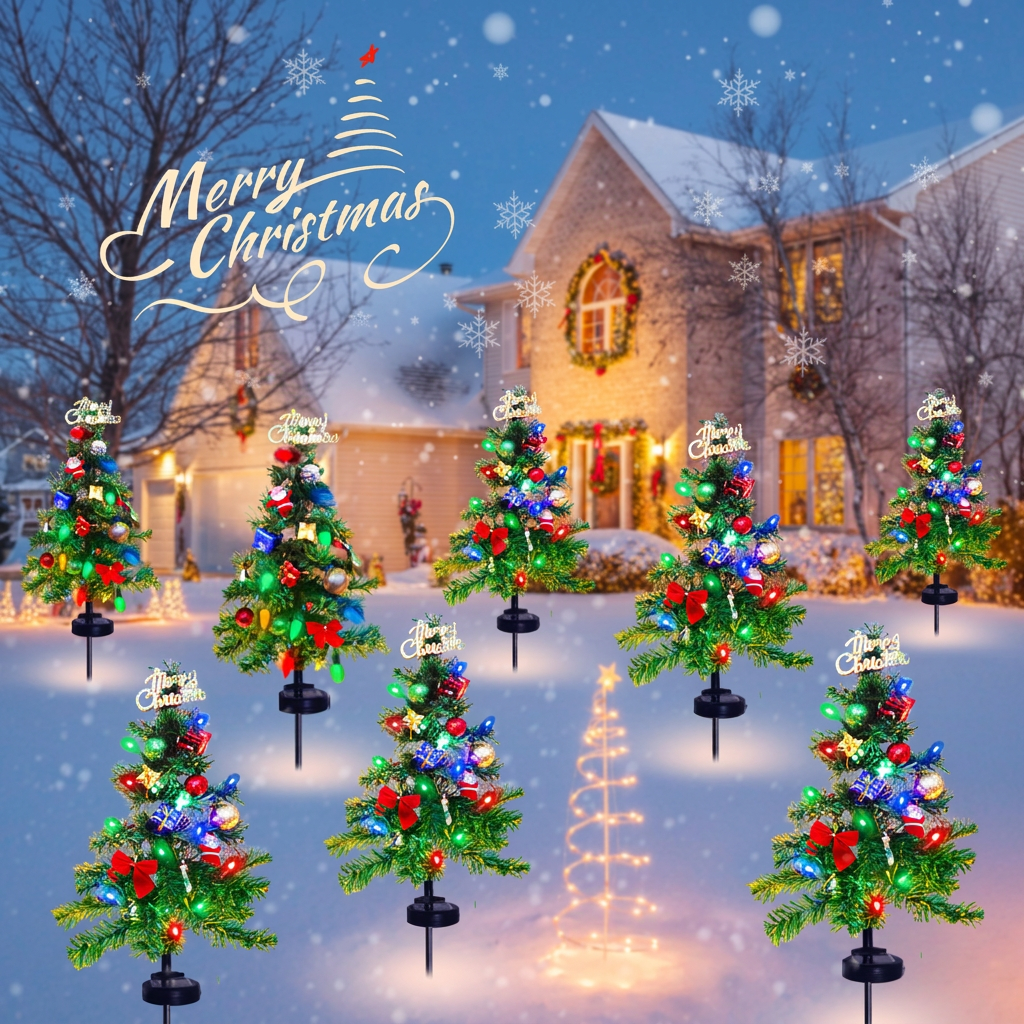 Solar Christmas tree stake lights lining a snowy front yard at night